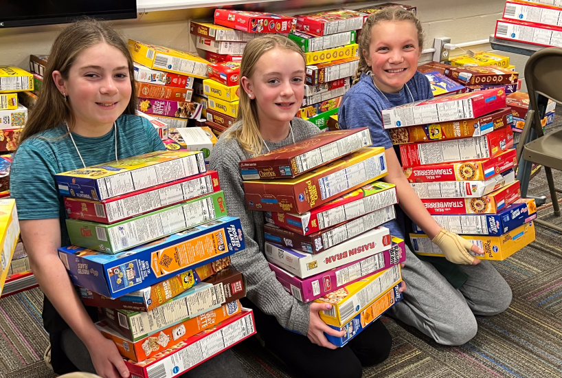 Student government leaders donate cereal boxes to local food pantries